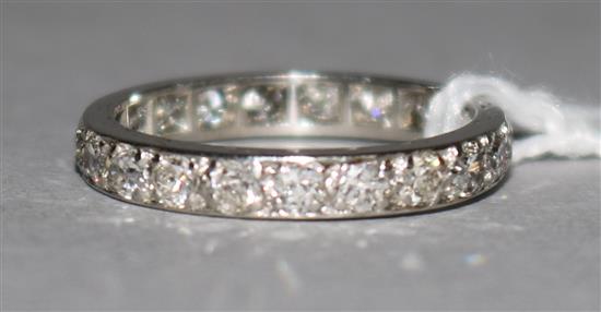 A platinum and diamond full eternity ring, with spare section, size J.